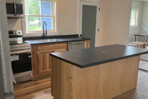 Redemption Construction general contractor in all things in home building and renovations has over 40 years experience in kitchen remodeling in Wisconsin Rapids with island and stainless steel appliances and wood floors